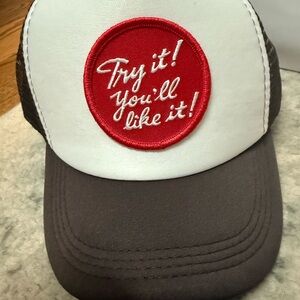 Brand new Brown and White Trucker Hat with Red Patch. From Nomad Jax.